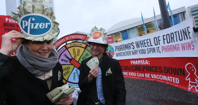 MSF stunt in Berlin outside the venue of the Gavi replenishment meeting, demanding GSK and Pfizer to reduce their price for the pneumococcal vaccine to $5 per child.  The stunt involves world leaders spinning a wheel of chance in which - when it comes to the PCV vaccine - pharma almost always wins. Photograph by Stephanie Pilick