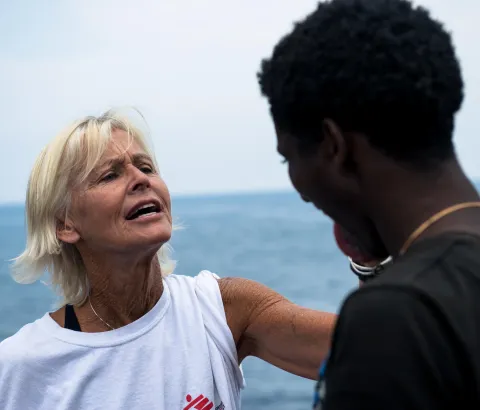 Nurse Mary Jo Frawley assesses the health conditions of people on the Phoenix’s main deck.